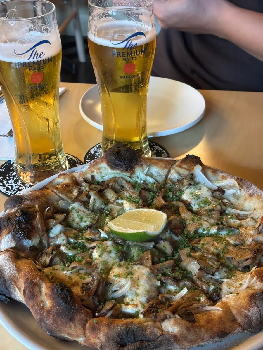 House-fermented yeolmu side dish served with the pizza
