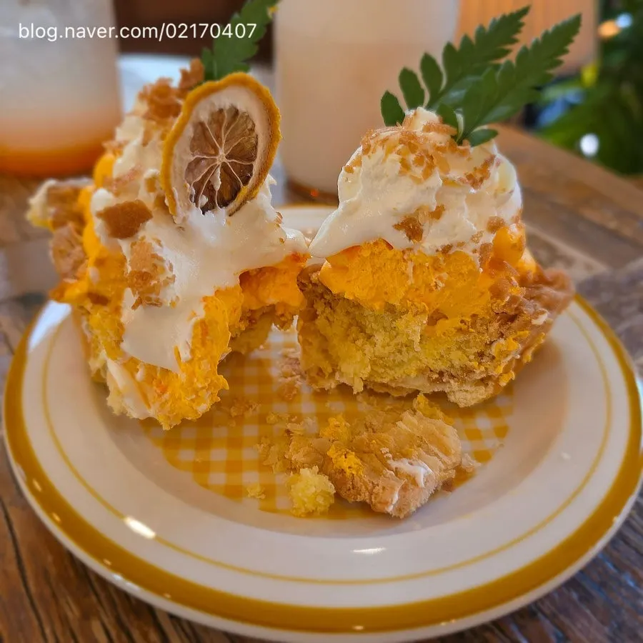 Cross-section of the cream pie showing lemon cream and fresh cream layers