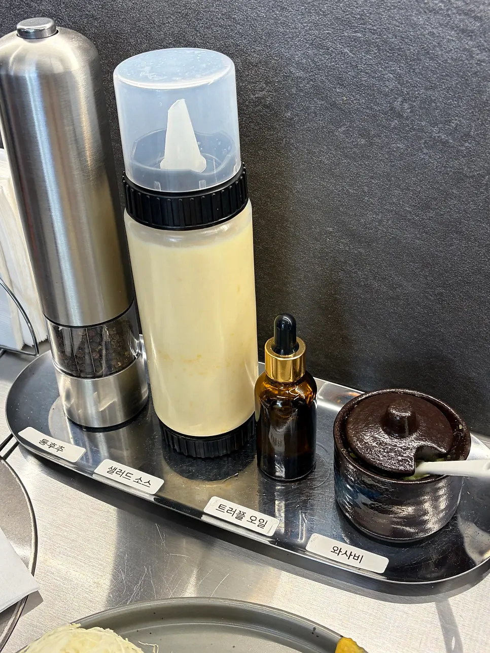 Wasabi, truffle oil, pepper, and corn dressing sauces