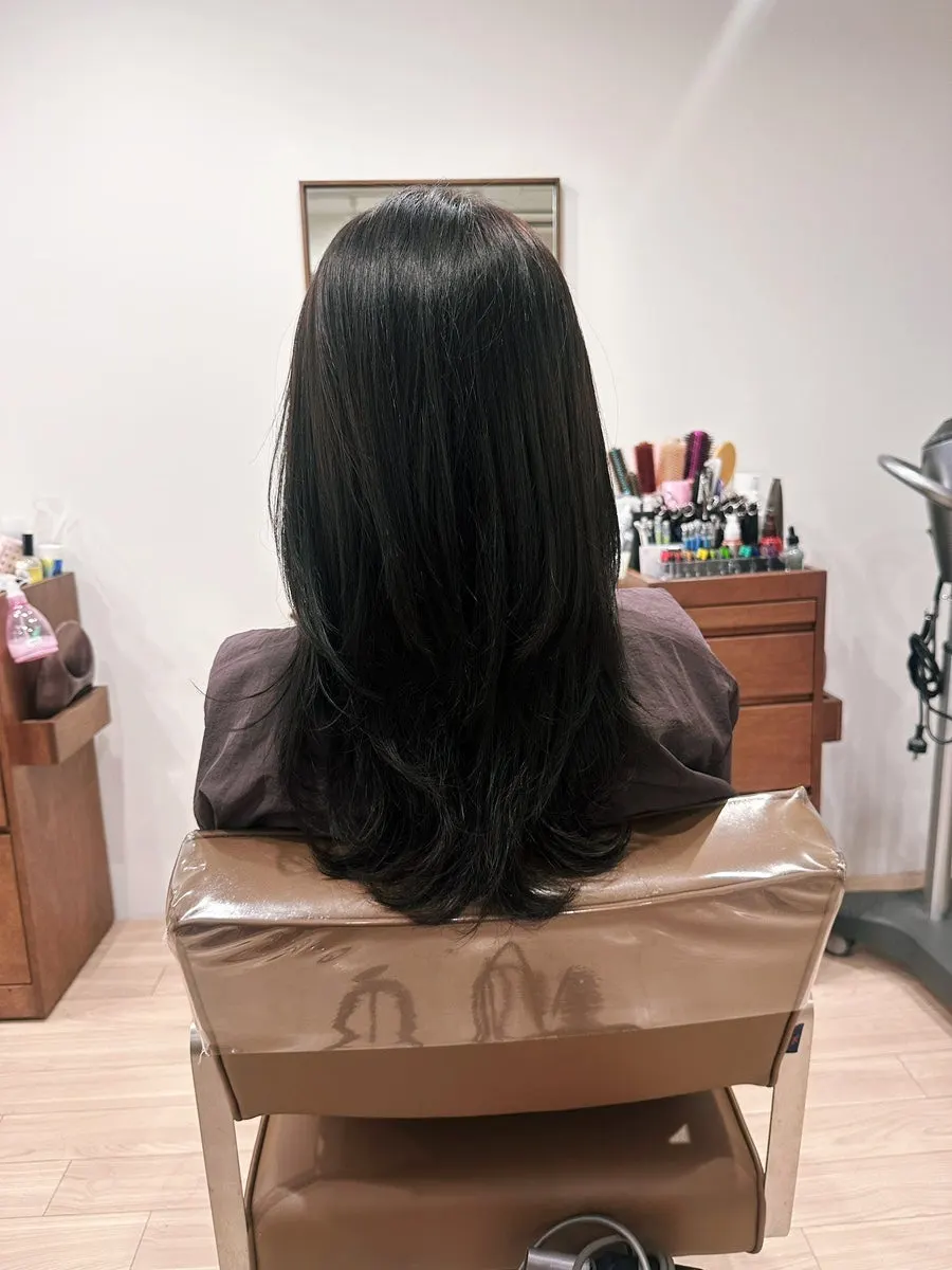 Toned-down blue ash brown hair after coloring