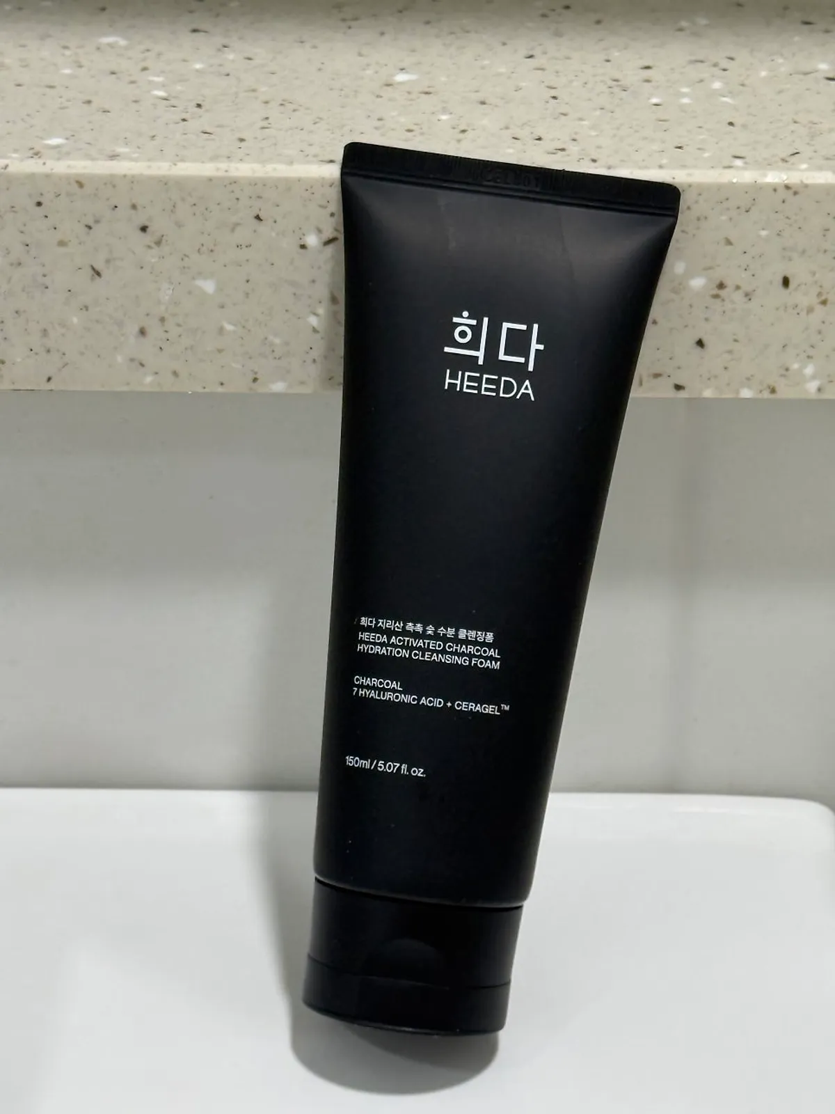HEEDA foam cleanser tube in black design