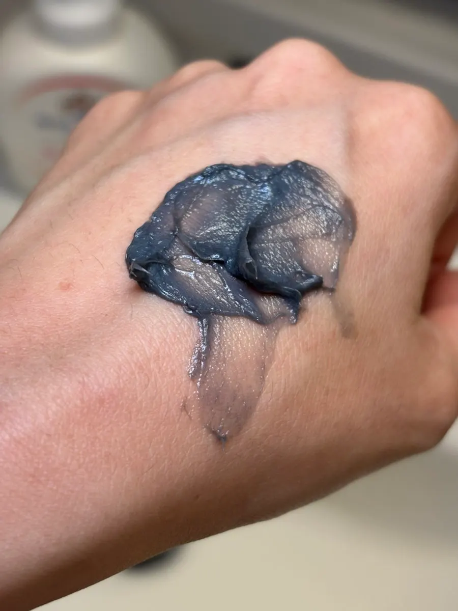 Testing the creamy texture of HEEDA charcoal foam cleanser