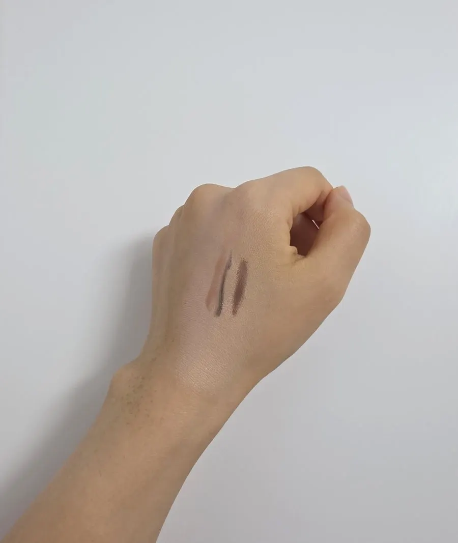 Cleansing power test with cushion, eyeliner, pearl eyeshadow, and lipstick on the back of the hand