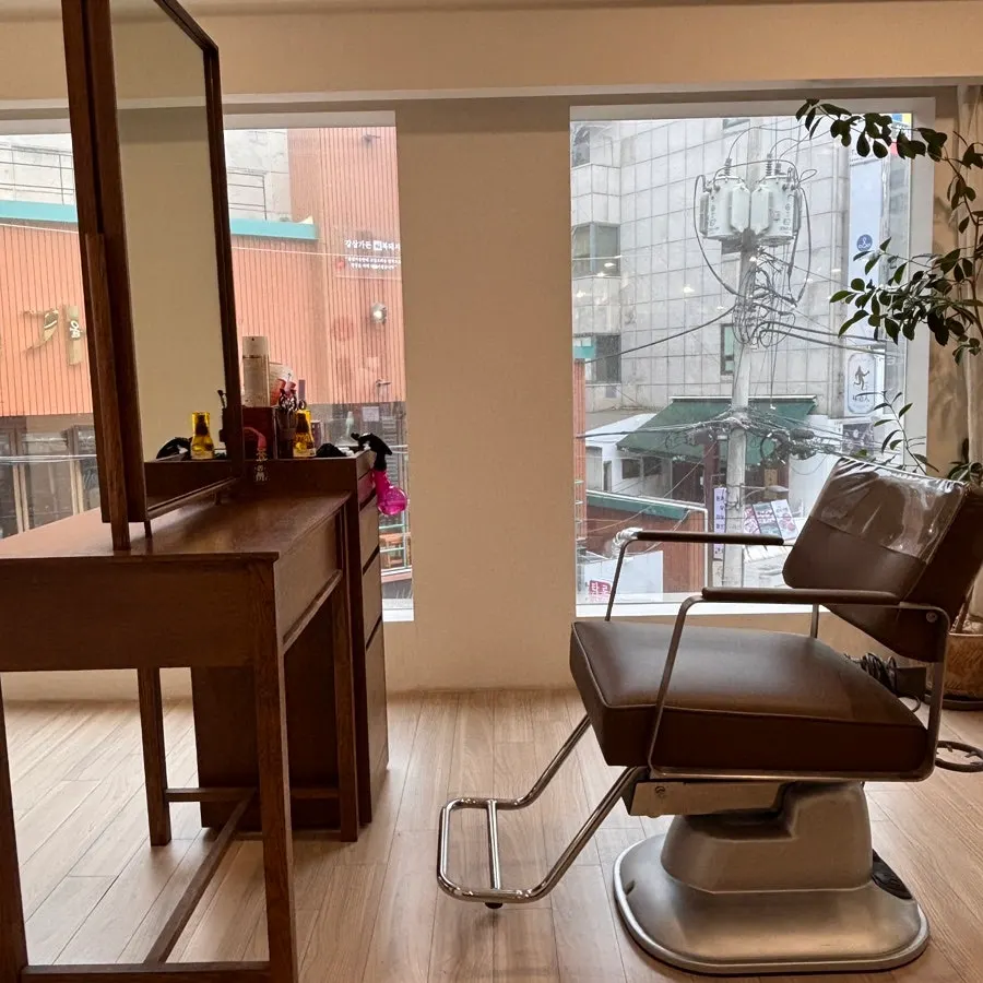 Wood-toned interior of Heeol Hair Gangnam Flagship Store
