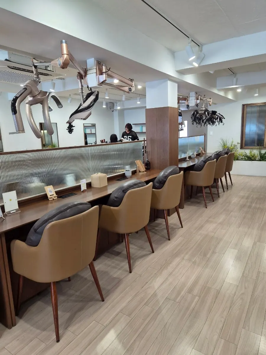 Well-spaced treatment seating at Heeol Hair