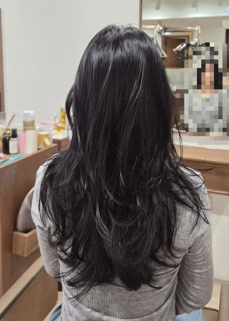 Side view showing the layered look brought out by the hush perm