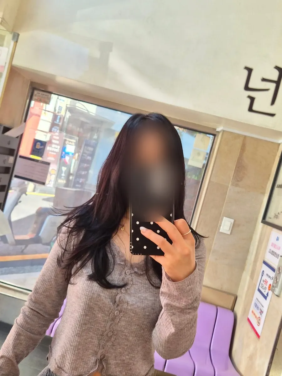 Full-body shot of the lighter hush perm style