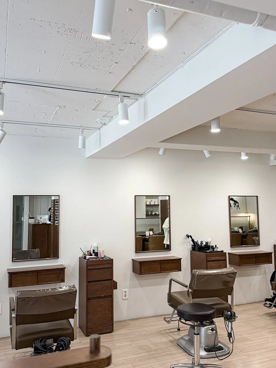 Seating by the full-length windows at Heeol Hair Gangnam
