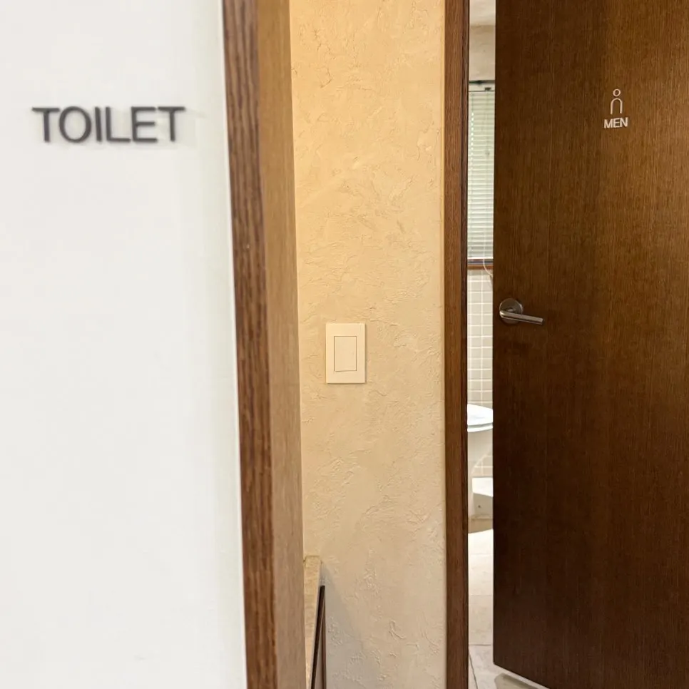 Entrance to the separate men's and women's restrooms inside the salon