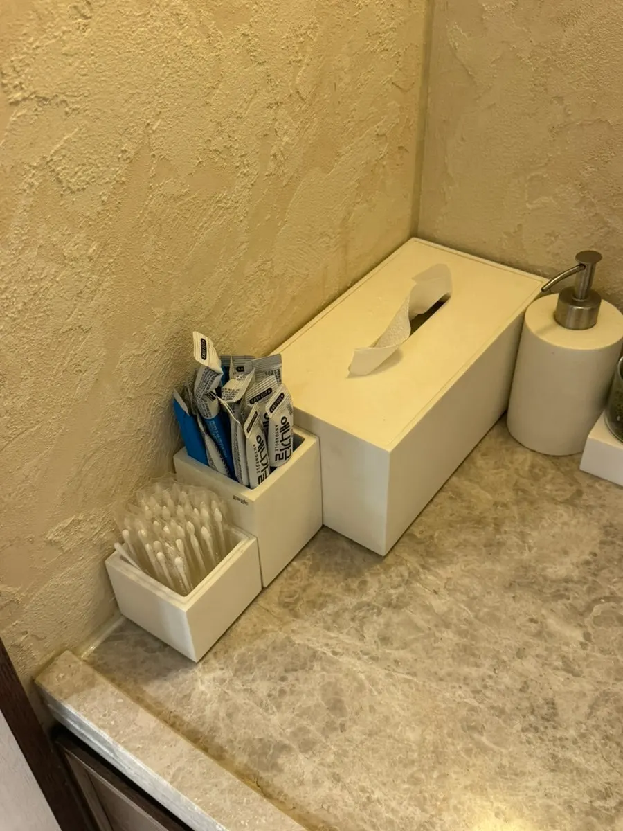 Restroom sink with disposable gargle sticks and cotton swabs