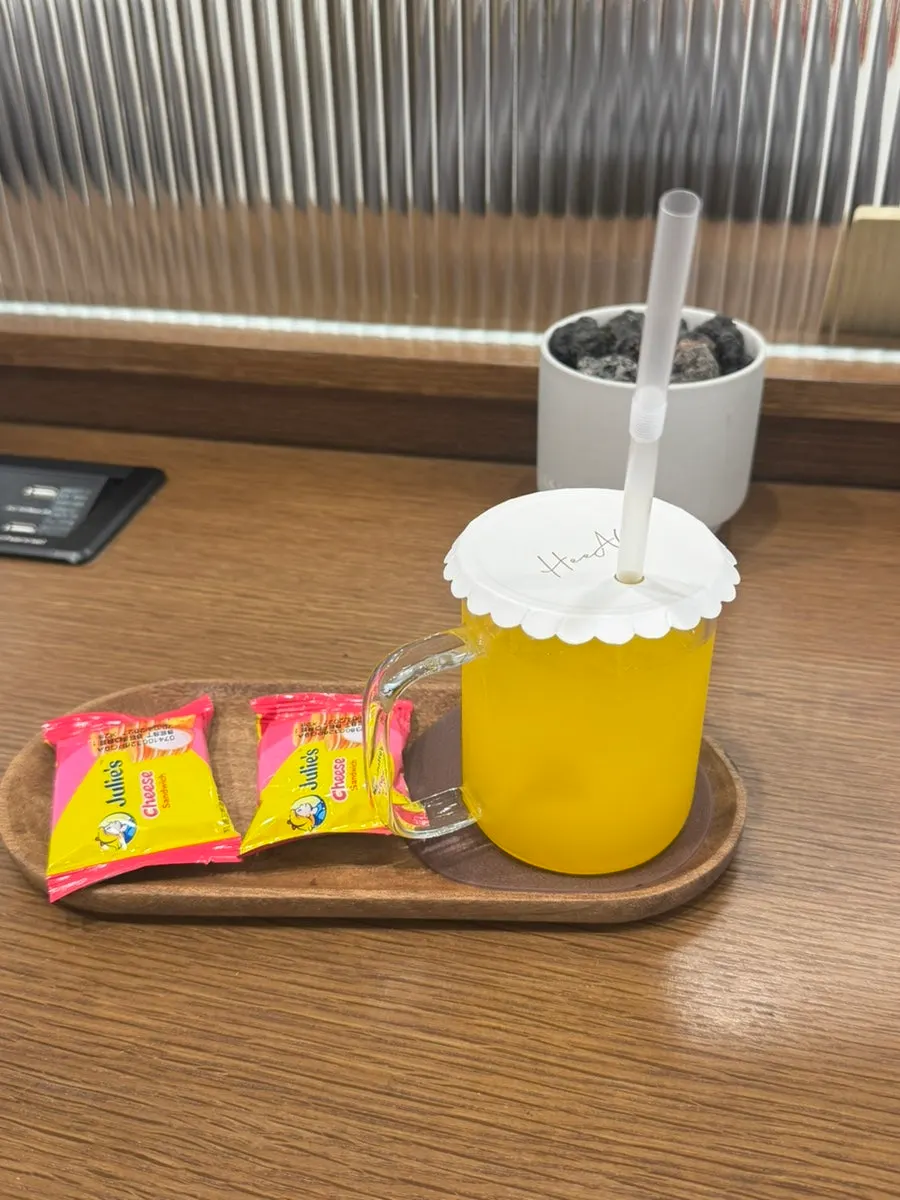 Orange juice and cheese crackers served