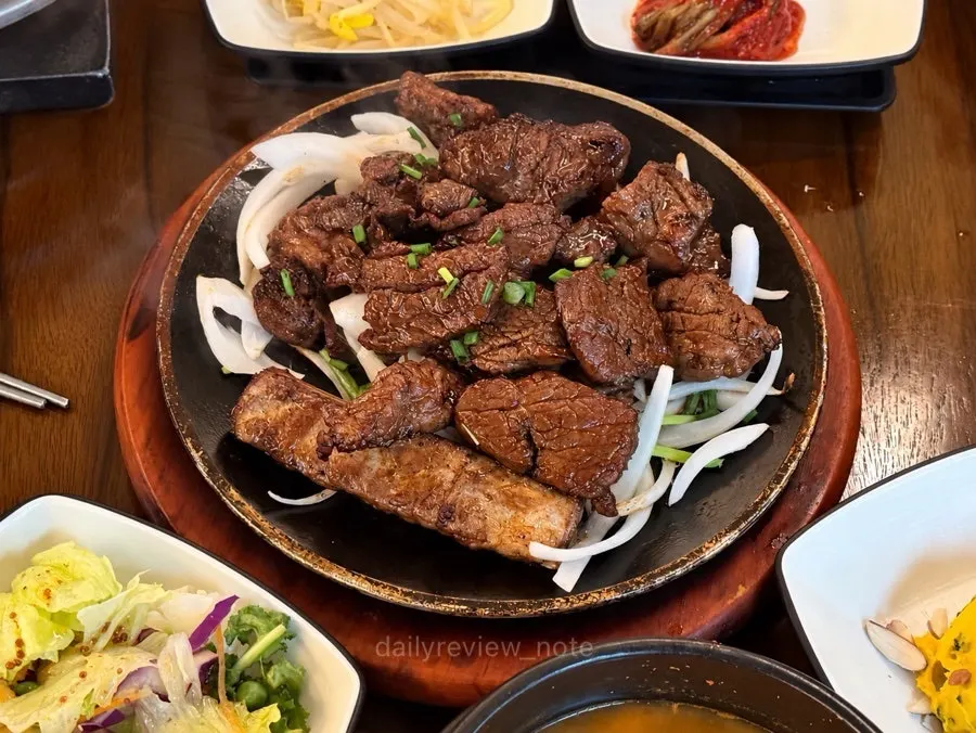 Table set with marinated short rib, pot rice, and doenjang jjigae