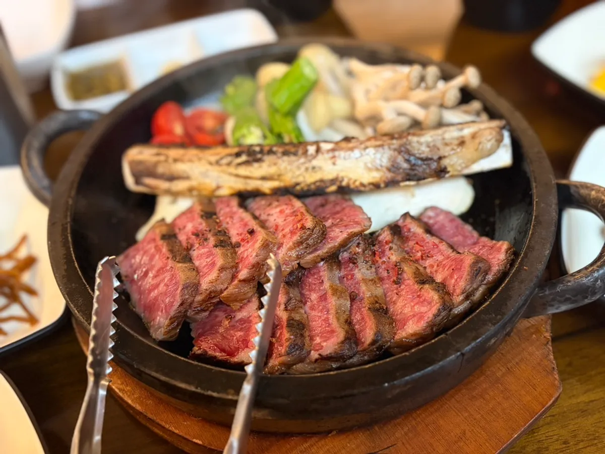Grilled hanwoo flower short rib served on the hot pan