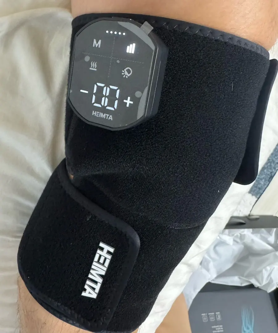 Leg massager worn with velcro straps on the knee