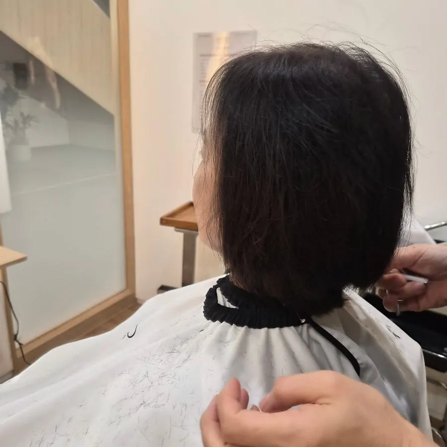 Mom's cut hair on the floor