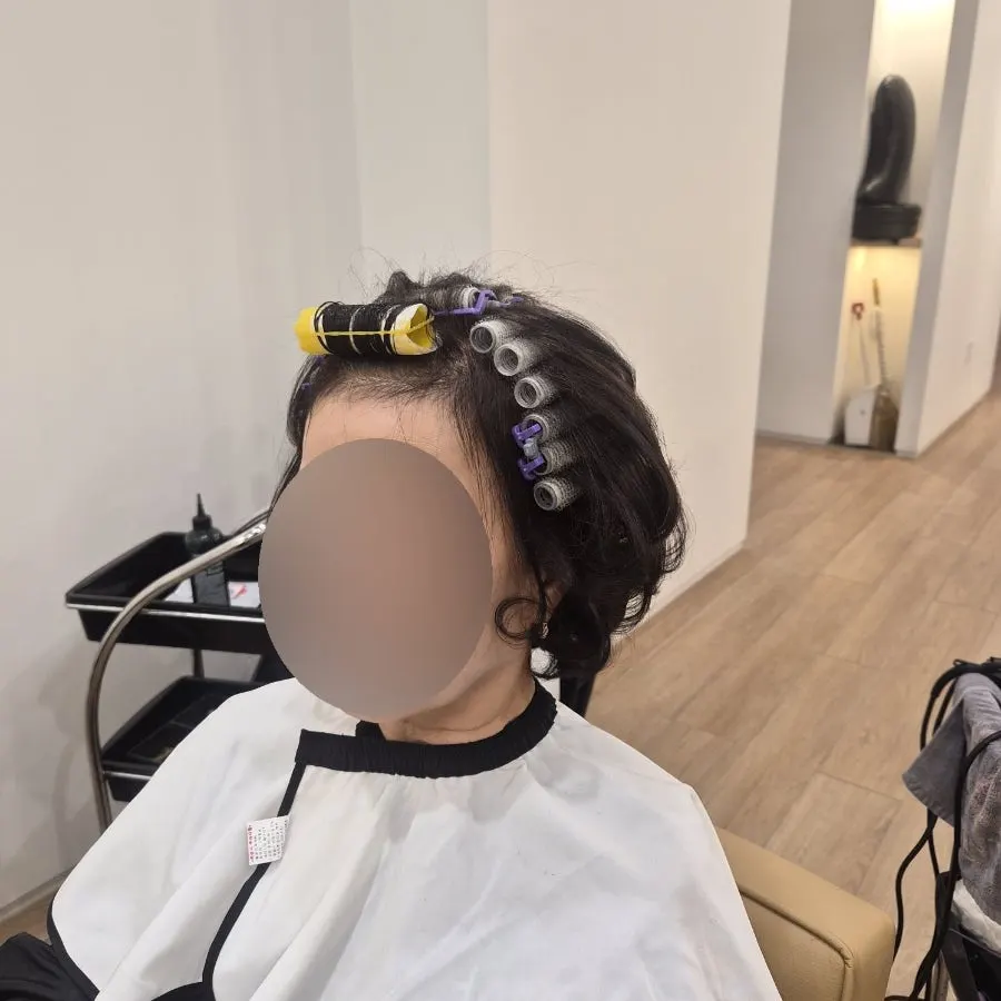 Carefully rolling the roots for the perm