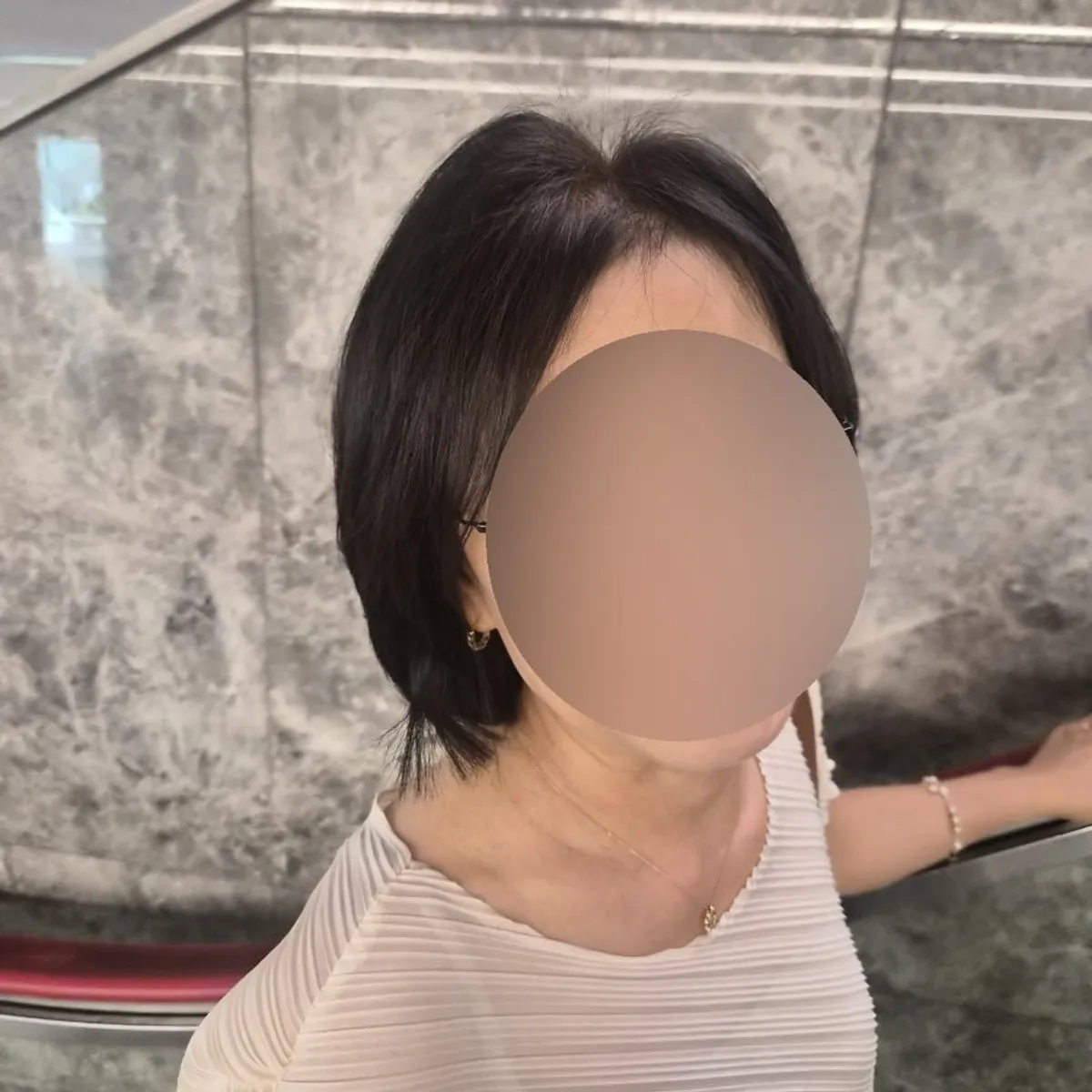 The finished bob style with hair loss areas covered