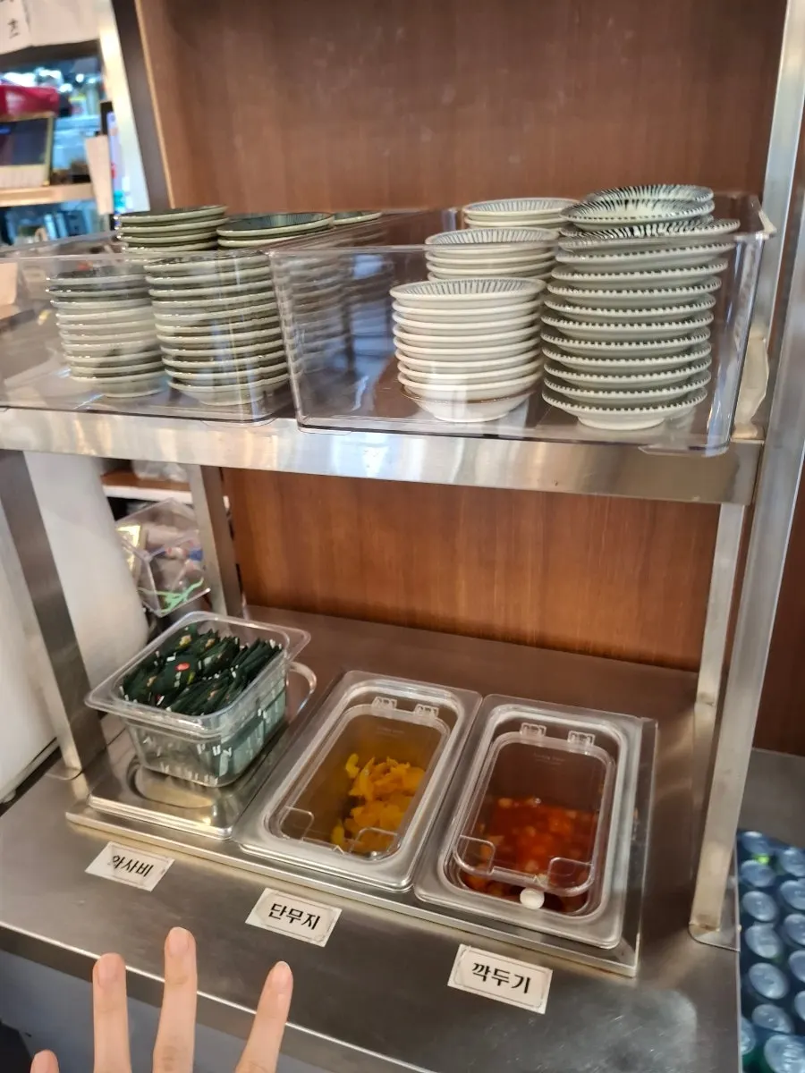 Self-serve bar with diced radish kimchi, pickled radish, and fresh wasabi