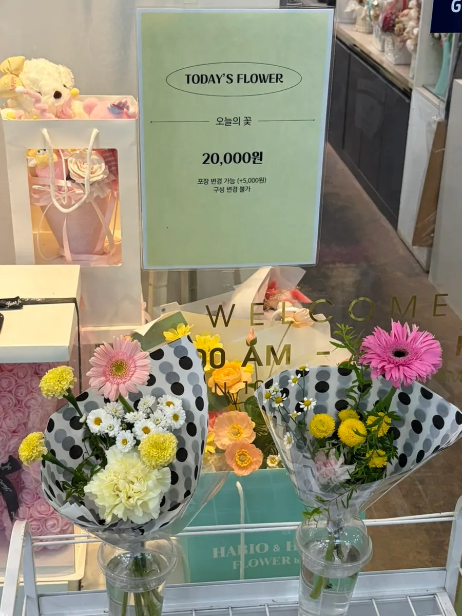Flower of the Day arrangements displayed in front of the shop