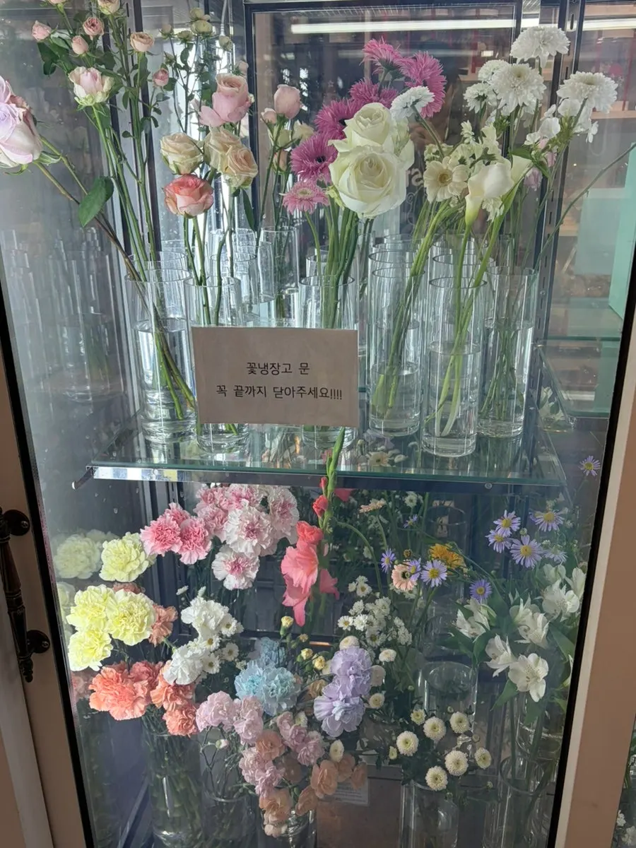 Store's flower fridge packed with fresh flowers
