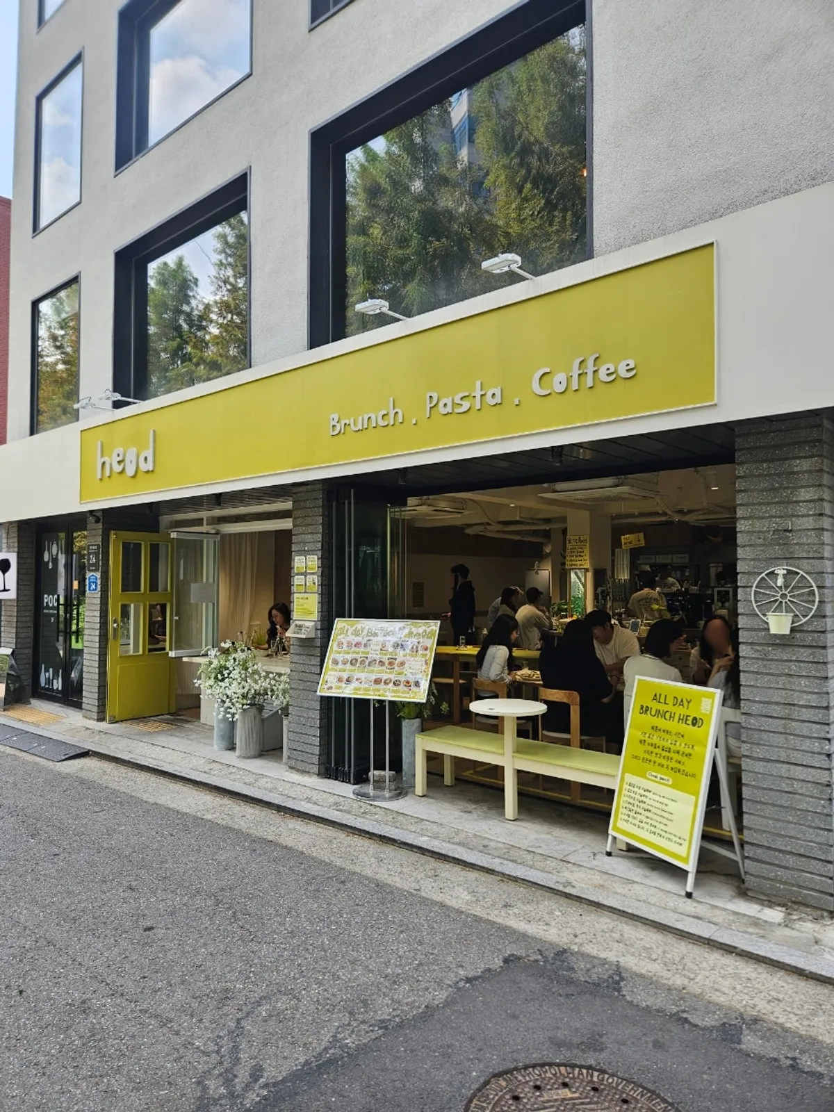 Olive-green signage exterior of HEOD Gongdeok near Daeheung Station