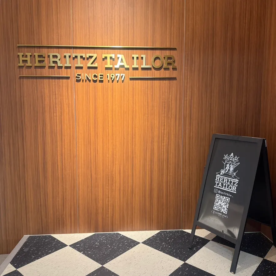 Heritz Tailor rental shop signage in front of Dongyang Building