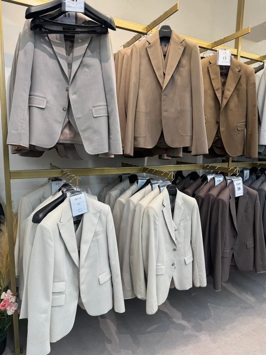 Close-up of rental suits with different fabric textures
