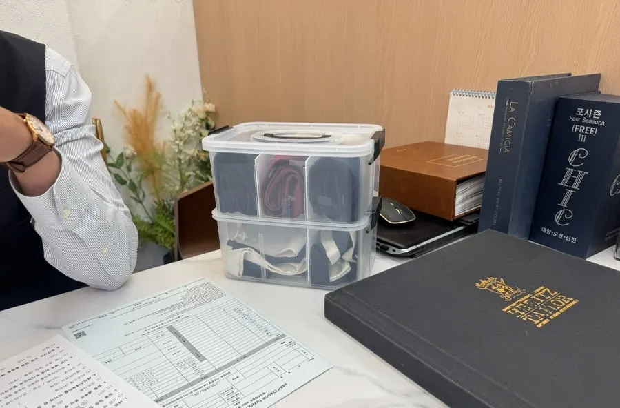 Consulting with the tailor while choosing a suit