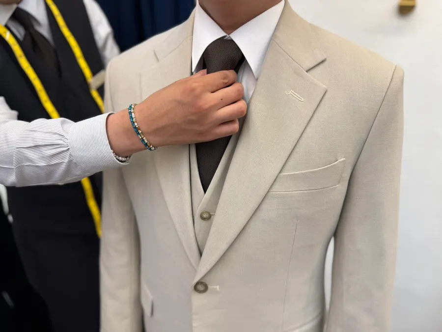 Bright brown suit with collar stitching detail