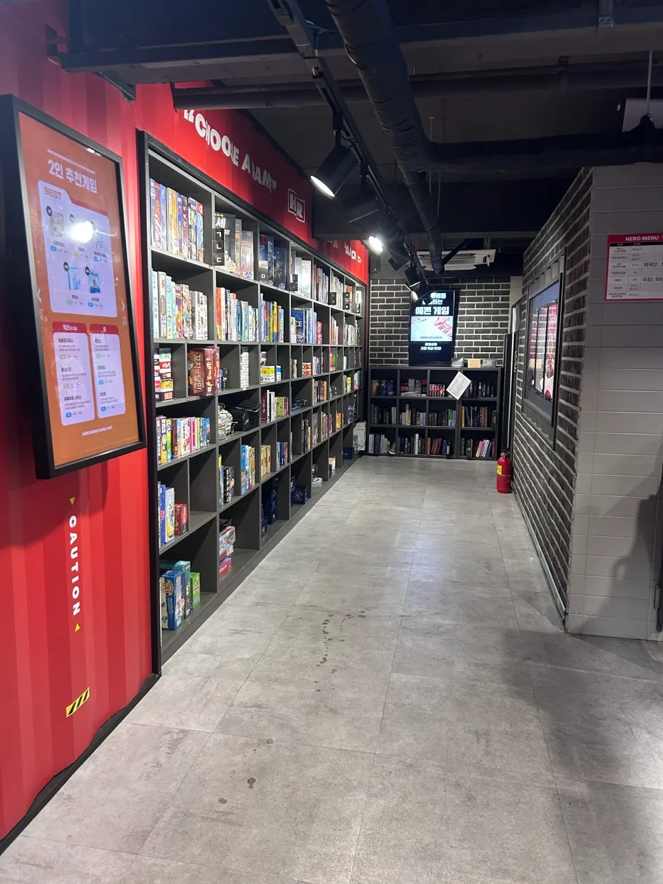 Wall lined with board games on display