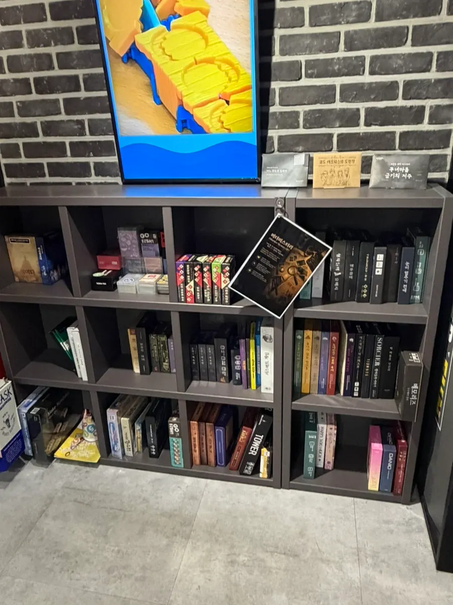 Shelves stacked with various board games