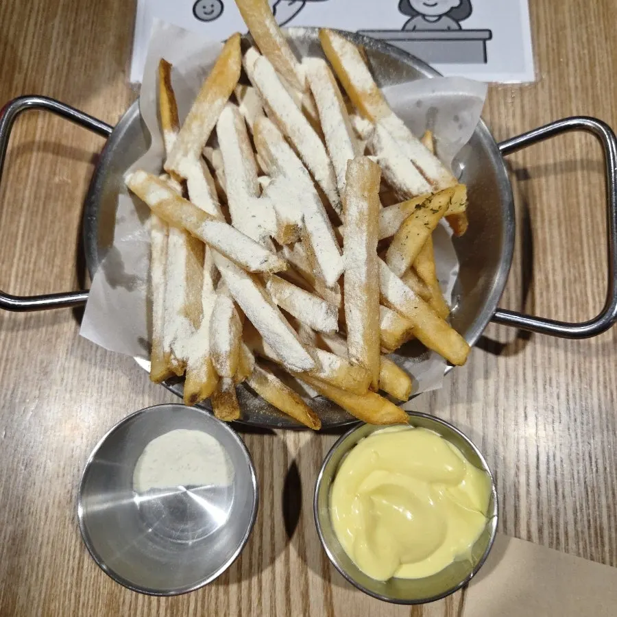 Honey butter garlic fries served with sauce on the side