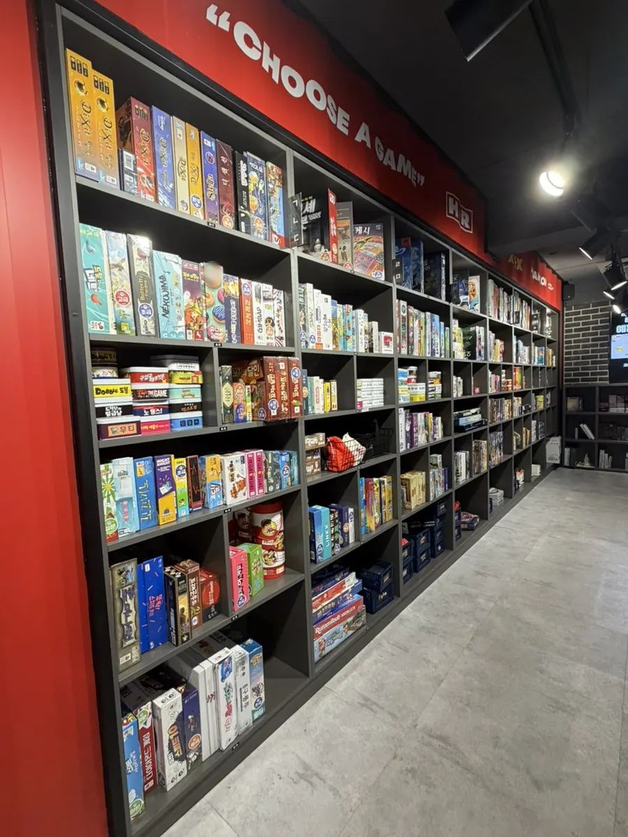 Shelves of board games sorted by category