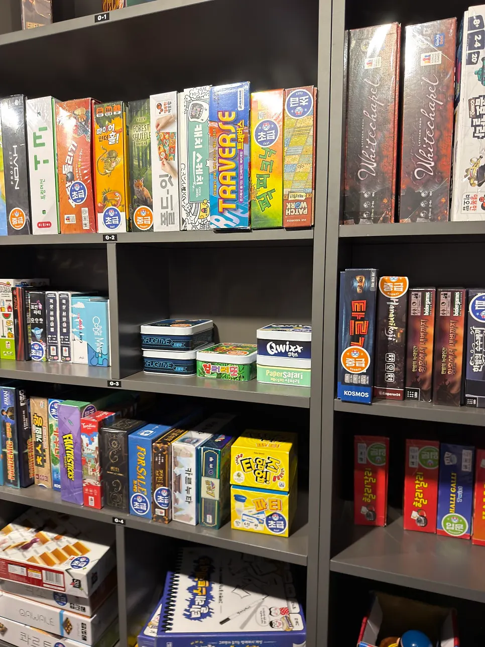 Wall lined with board game boxes