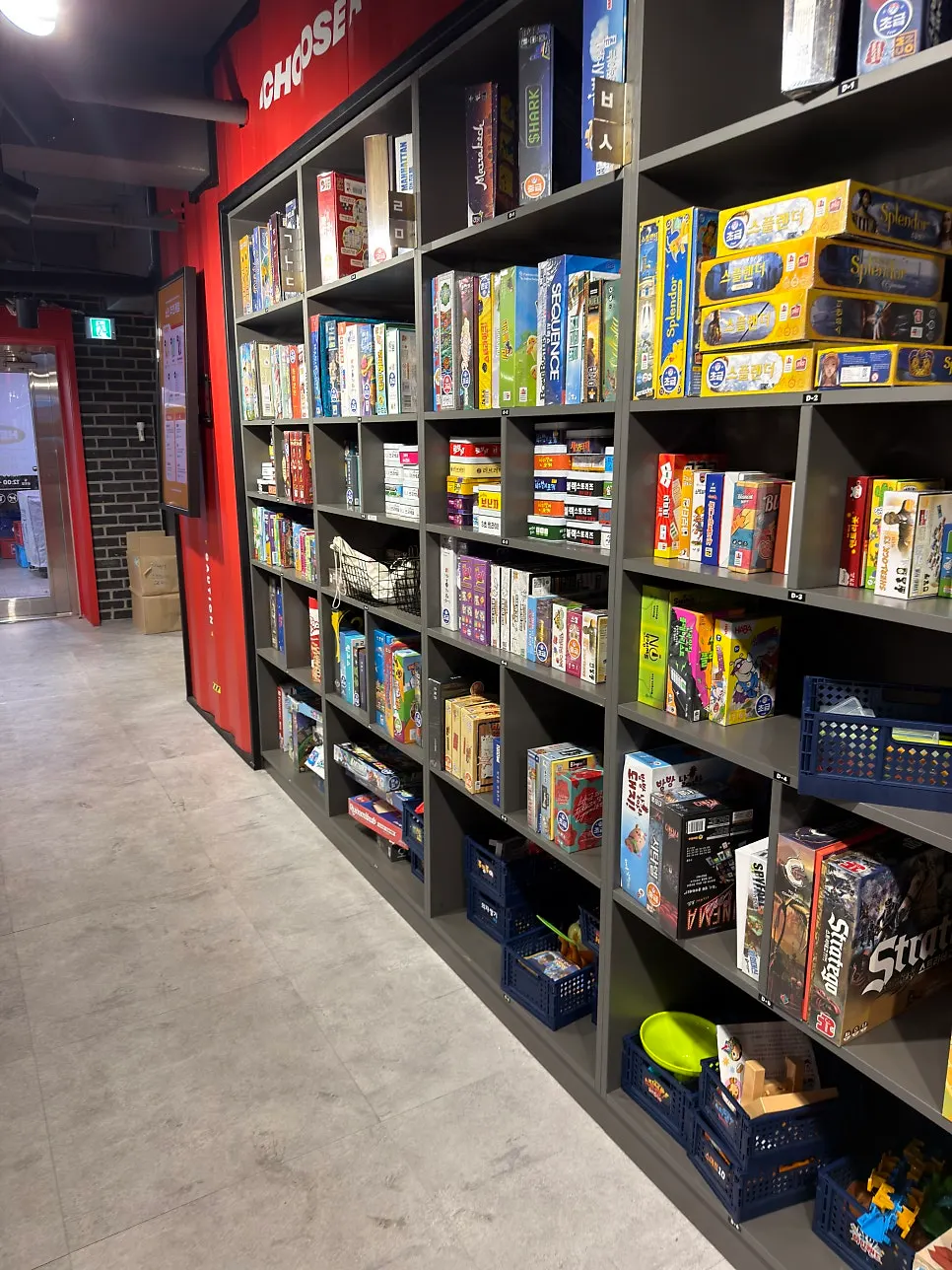 Aisle in front of the board game shelves