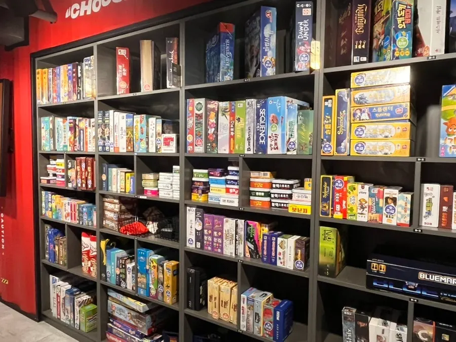 Wall shelves lined with board games