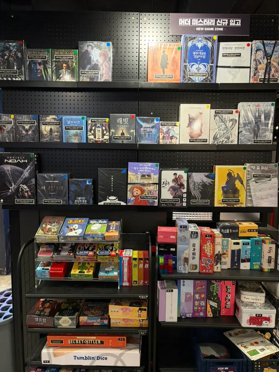 Bookcase filled with board games at Hero Board Game Cafe