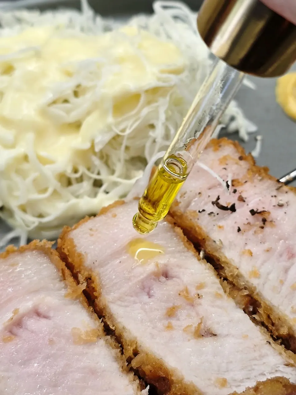A piece of black pork katsu with pepper added
