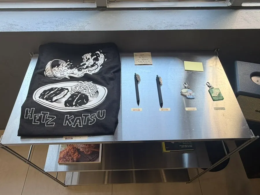Handwritten notes about the restroom and merch