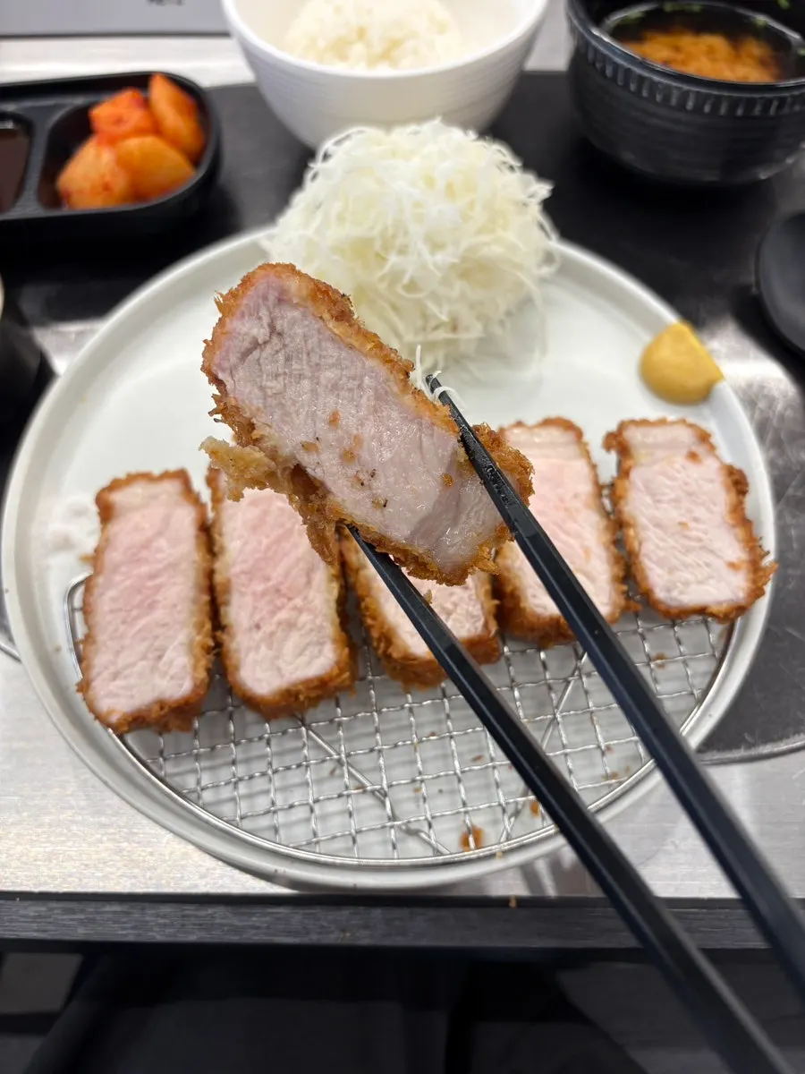 Close-up of tonkatsu drizzled with truffle oil