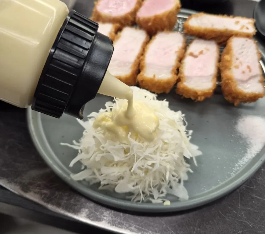 Salad drizzled with yuzu mayo dressing