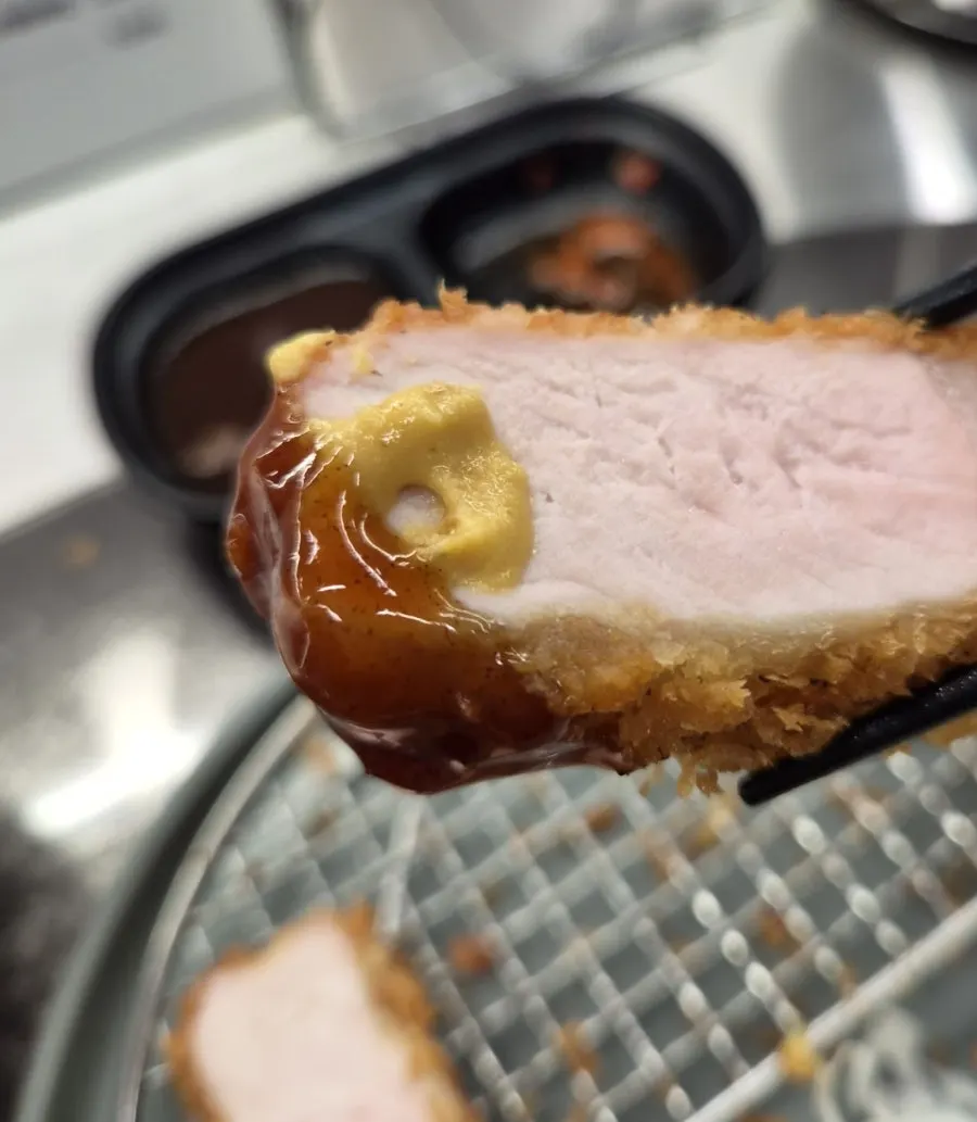 Katsu combined with mustard, tonkatsu sauce and pepper