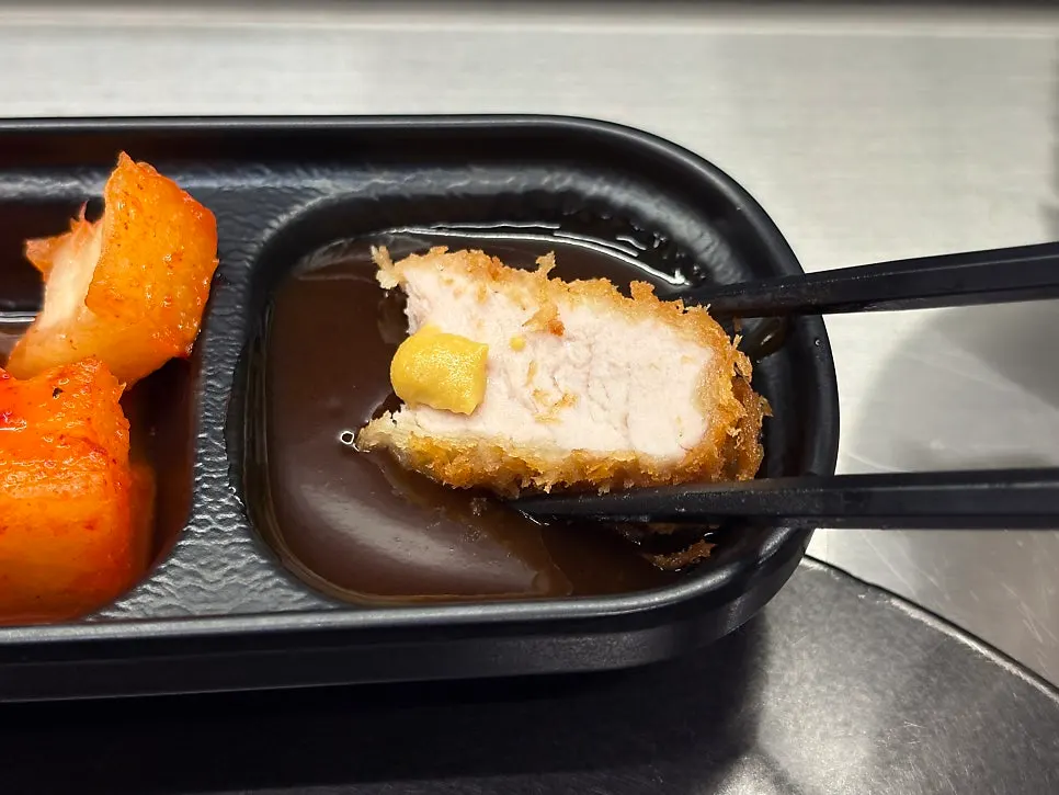 Mustard served alongside tonkatsu sauce
