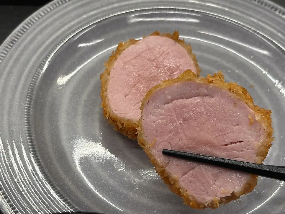 Tenderloin katsu with pink-tinged flesh visible