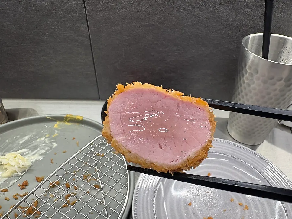 A piece of tenderloin katsu served with salt