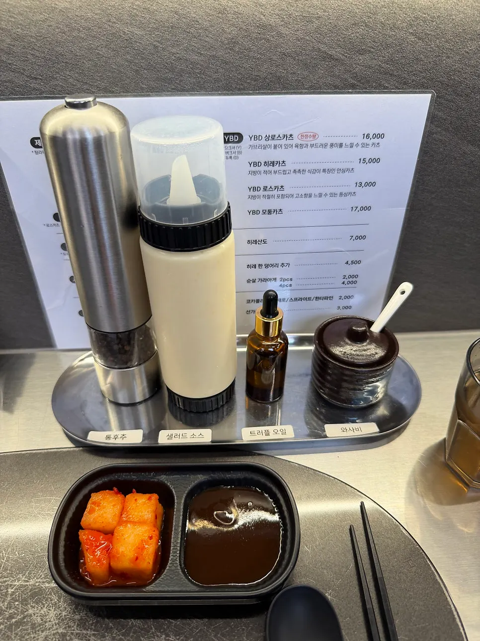 Four sauces and oils set at the table