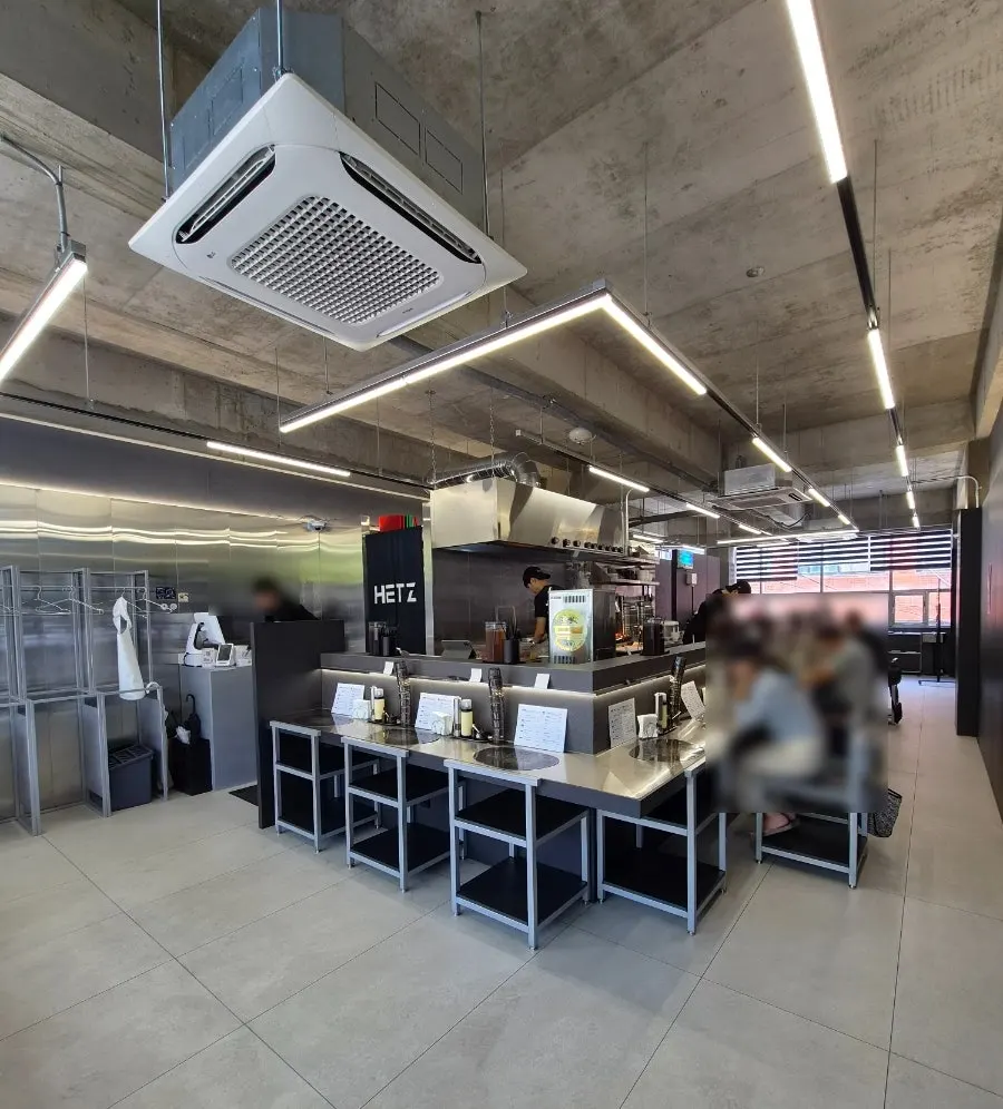 Interior with all bar-table seating in unified gray tones