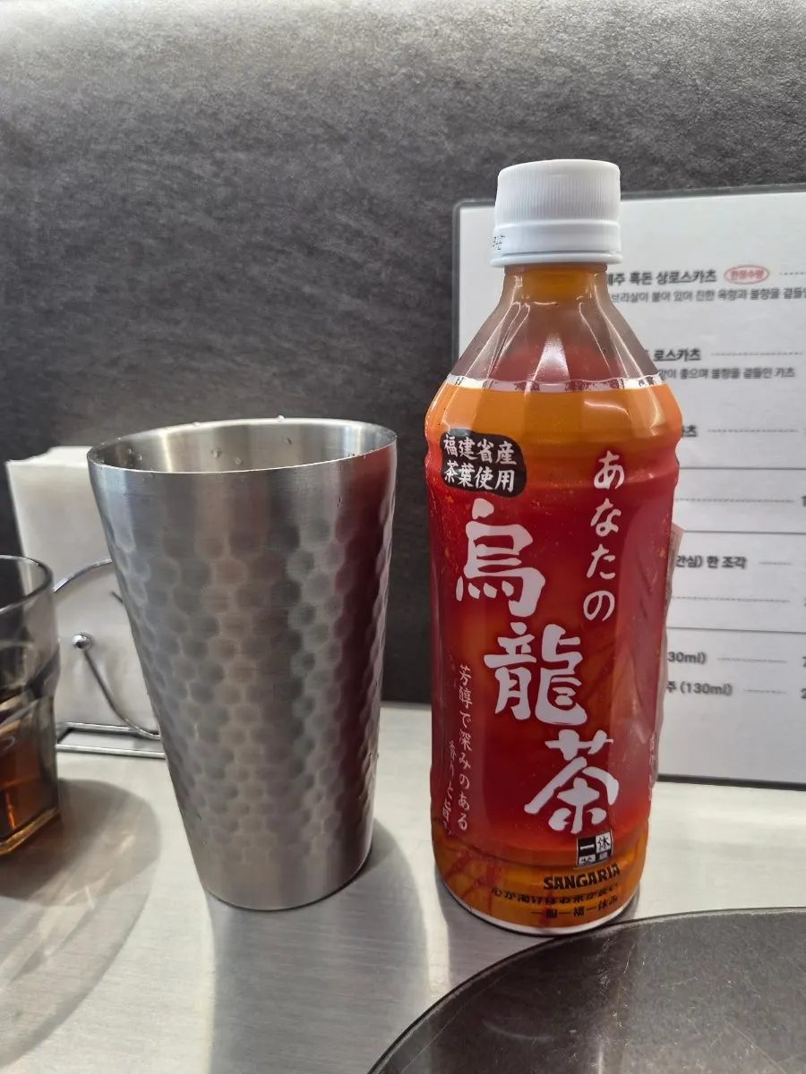 Oolong tea bottle served with a glass of ice
