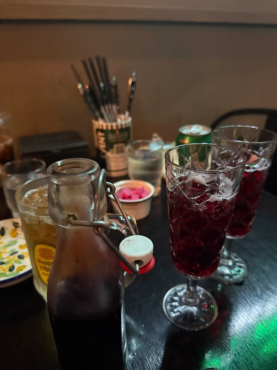 Bottle wine and a highball glass on the table