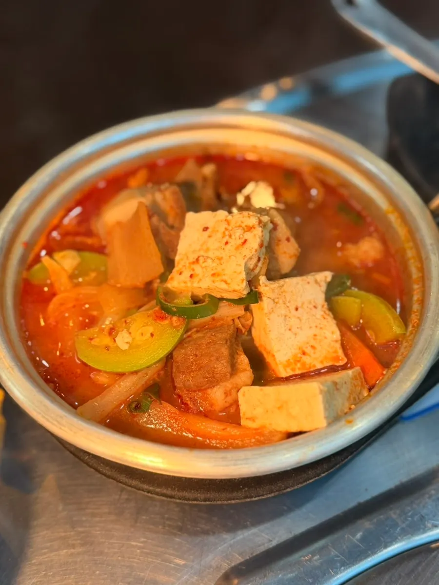Black pork stew set served with a bowl of rice